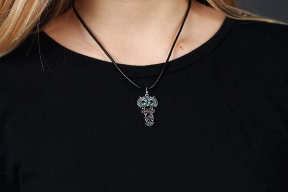 Women's silver pendant "Gentle Owl" with green eyes