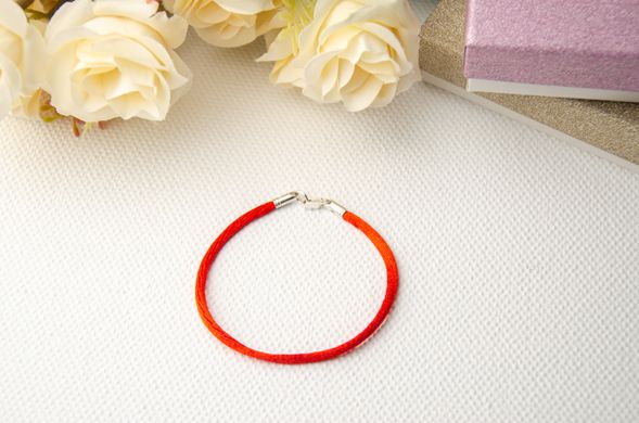 Red silk cord with a silver lock