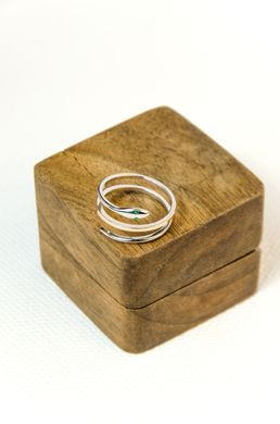 Silver ring "Snake" with green cubic zirconia