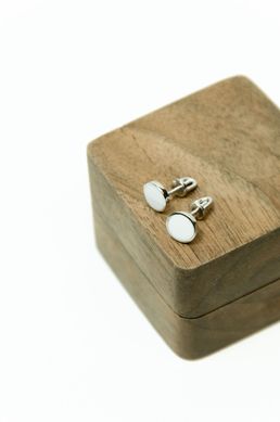 Silver stud earrings with white enamel